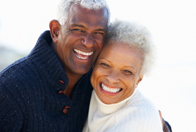 Couple smiling after treatment for receding gums in Irvine, CA